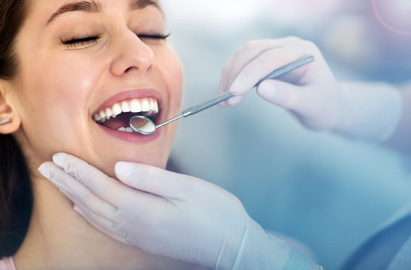 Woman getting dental exam in Hackettstown, NJ