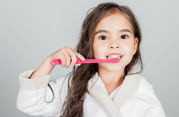 Young girl brushing her teeth at our Hackettstown dental office.