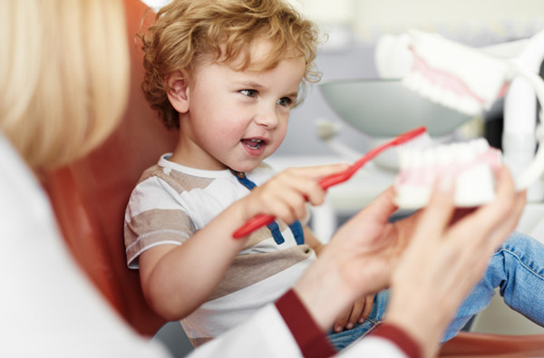 Little boy learning to brush teeth in Hackettstown, NJ